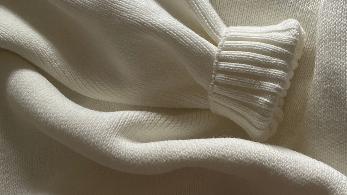 Gros plan sur la texture d une maille de pull en laine